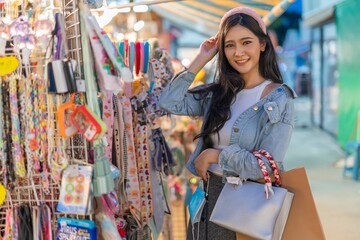 Asian woman shopping in a random night market in Bangkok, Thailand
