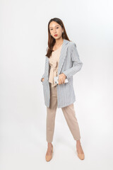 Photograph of a young, beautiful and sexy asian Thai lady model in professional business attire with a mobile phone on hand