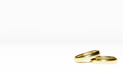 Golden wedding rings on white background