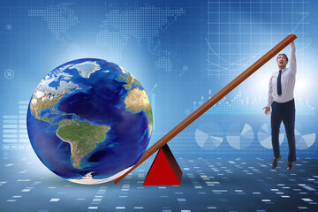 Businessman lifting the earth in challenge concept