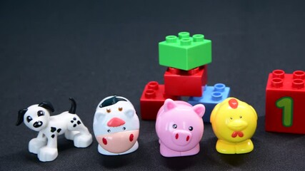 Some early Years Farmyard Animals and some building blocks to aid in child's developement.