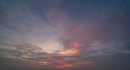 Sunset sky. Abstract nature background. Dramatic blue with orange colorful clouds in twilight time.