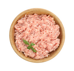 Raw chicken minced meat with basil in bowl on white background, top view