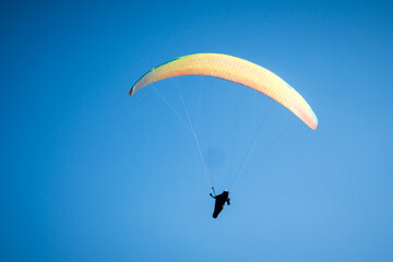 Naklejka na ściany i meble paragliding flight in the mountains. Le Grand-Bornand, France