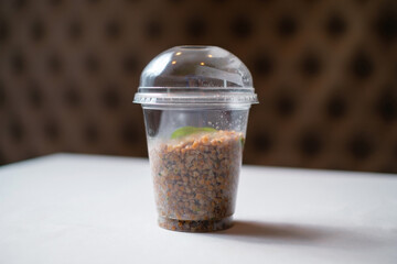 Healthy takeaway food. Boiled buckwheat in a transparent plastic container.