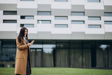 Fototapeta premium Young business woman using phone