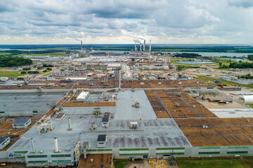Aerial View of Massive Coal Power Plant and Manufacturing Operation. Smoke Stacks, etc. 