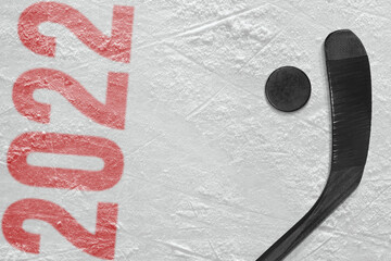 Fragment of a hockey arena, stick and puck