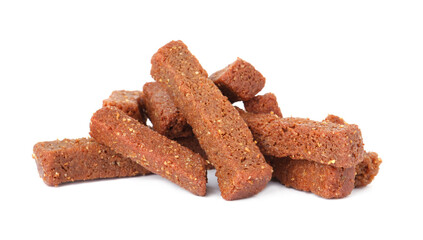 Pile of delicious crispy rusks on white background