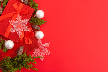 Beautiful Christmas frame on a red background for your congratulations. New Year, Christmas, winter holidays, New Year's mood, Christmas spirit. There are no people in the photo. Color image.