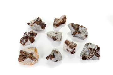 macro mineral stone Staurolite on a white background