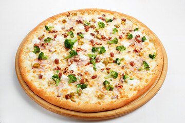 Pizza with ham, broccoli, beans and olives.. Italian kitchen and cooking concept. Chief with a pizza cutter cutting pizza to pieces at Neapolitan pizzeria.