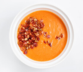Bowl of cream soup with pumpkin with bacon. Restaurant menu