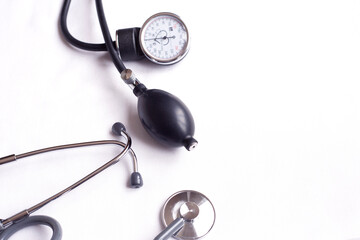 Stethoscope on white background, top view. Space for text