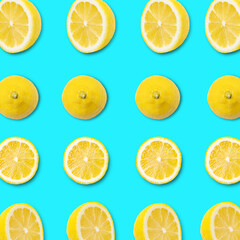 fresh sliced lemon pattern on blue background. Top view. Colorful concept healthy and vegan image