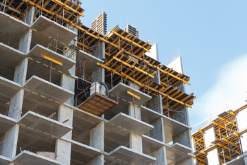 Residential building. Construction of a building using concrete construction technology. High brick residental building
