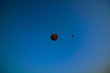 Hot air balloon tour. Hot air balloon tour from below at sunrise in Cappadocia