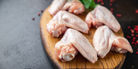 raw chicken wings meat poultry fresh meal snack on the table copy space food background rustic. top view keto or paleo diet