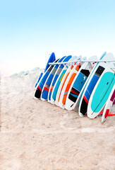 Colored Longboards by the sea. Concepts beach holiday concept. Copy space