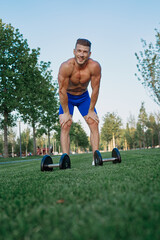 sporty man in park exercise crossfit workout