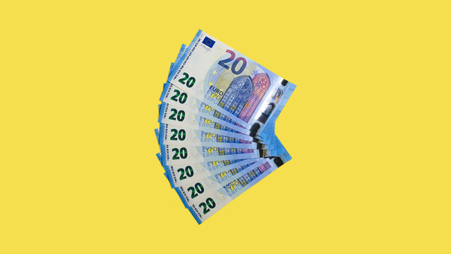 20 Euro Geldscheine auf gelbem Hintergrund