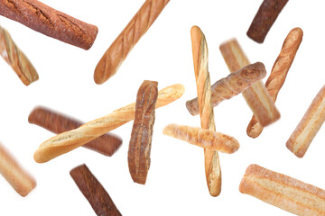 Freshly baked tasty baguettes falling on white background