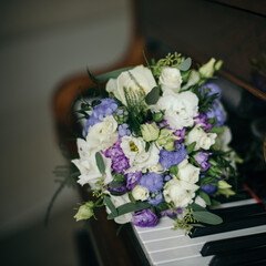 wedding bouquet on piano keyboard