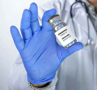 Third booster dose of the Covid-19 vaccine, Doctor holds vaccine in the hand