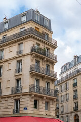 Fototapeta na wymiar Paris, beautiful buildings, rue Faidherbe in the 11e district 