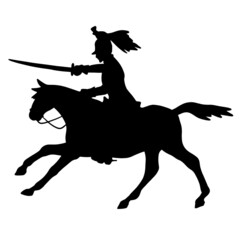 Silhouette of a horseman with a saber. The military cavalry is attacking. Soldier of the Napoleonic War