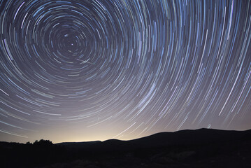 A star trail in a meteor shower night