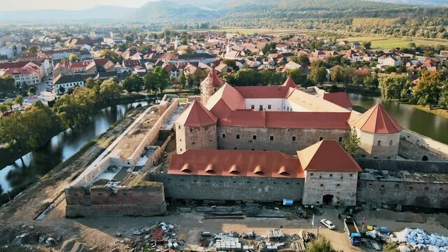 Aerial drone view of the Fagaras, Romania. Fagaras Citadel surrounded by a moat, buildings, roads, greenery