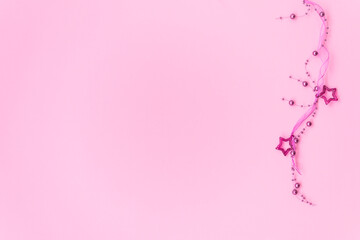 Trending pink christmas minimalistic background this space for your text. flat lay, top view, copy space