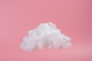 white decorative cloud of cotton fibers or wadding on a pink background. Trendy image on pink background
