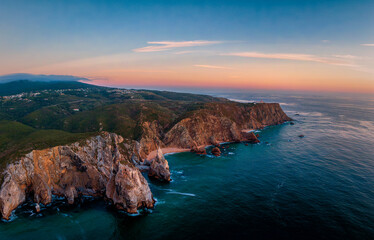 Fototapeta premium Aerial picture of the Cabo da Roca coastline during sunset, with beaches, rocks and coastline of Portugal