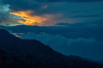 Fototapeta na wymiar 657-44 Sunset Peeking Through the Clouds