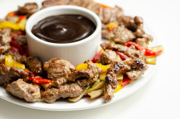 Beef strips with mixed peppers and mangetout served with black bean sauce