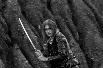 Warrior woman with katana sword in black and white