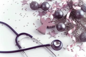 Merry Christmas and Happy New Year concept. Stethoscope with Christmas decorations. Greeting card. Copy space.