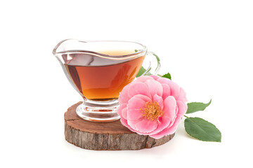 Damask rose flower and tea isolated on white background.