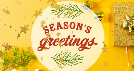 Image of season's greetings text over stars falling and presents at christmas