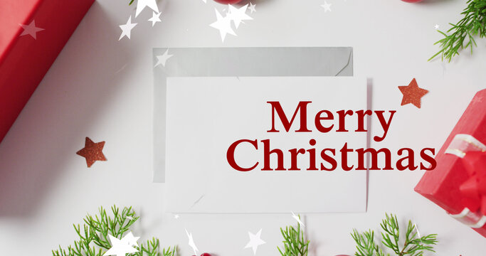 Image of merry christmas text over stars