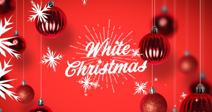 Image of white christmas text with falling snowflakes and christmas baubles on red background