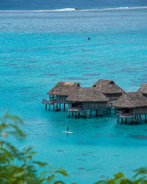 View of a luxury resort with tourists on Moorea island, French Polynesia.