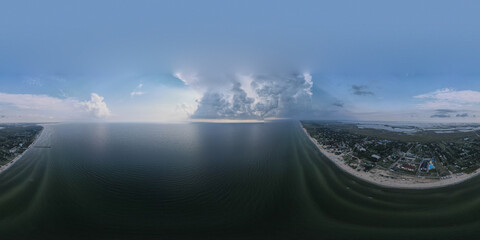 Aerial view from a drone to the clouds over the sea