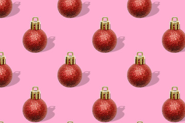 Christmas New Year holiday creative minimal seamless pattern pink background with red baubles...