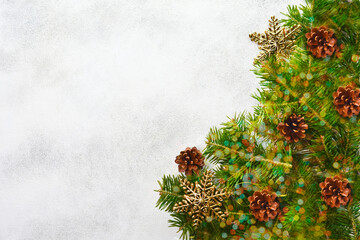 xmas background with festive natural zero waste decoration, fir branch sprigs with pine cones top view flat lay, merry christmas background with copy space text.