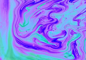 Abstract background of lilac and blue marble. The lines and waves of acrylic paint create an...