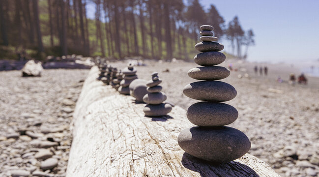 Stacked stones at the ocean beach create a sense of harmony and Zen