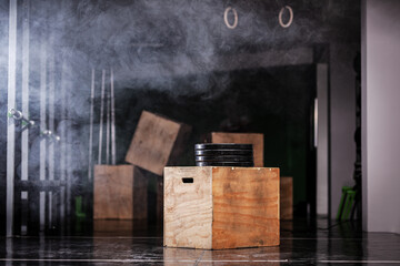 Workout interior with wooden boxes and smoke. Generic fitness studio background.